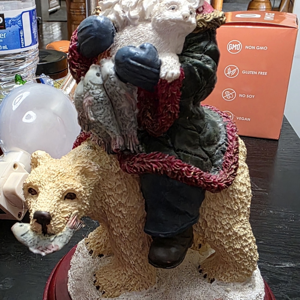 Santa Figurine on Polar Bear with Birds